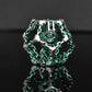 BEHOLDER'S GATES HOLLOW METAL DICE SET - GREEN AND SILVER