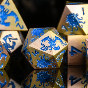 MONSTER MANUAL METAL DICE SET - BLUE AND GOLD